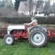 David Thompson, working atop a tractor at the Ted Erichsen Heritage Garden